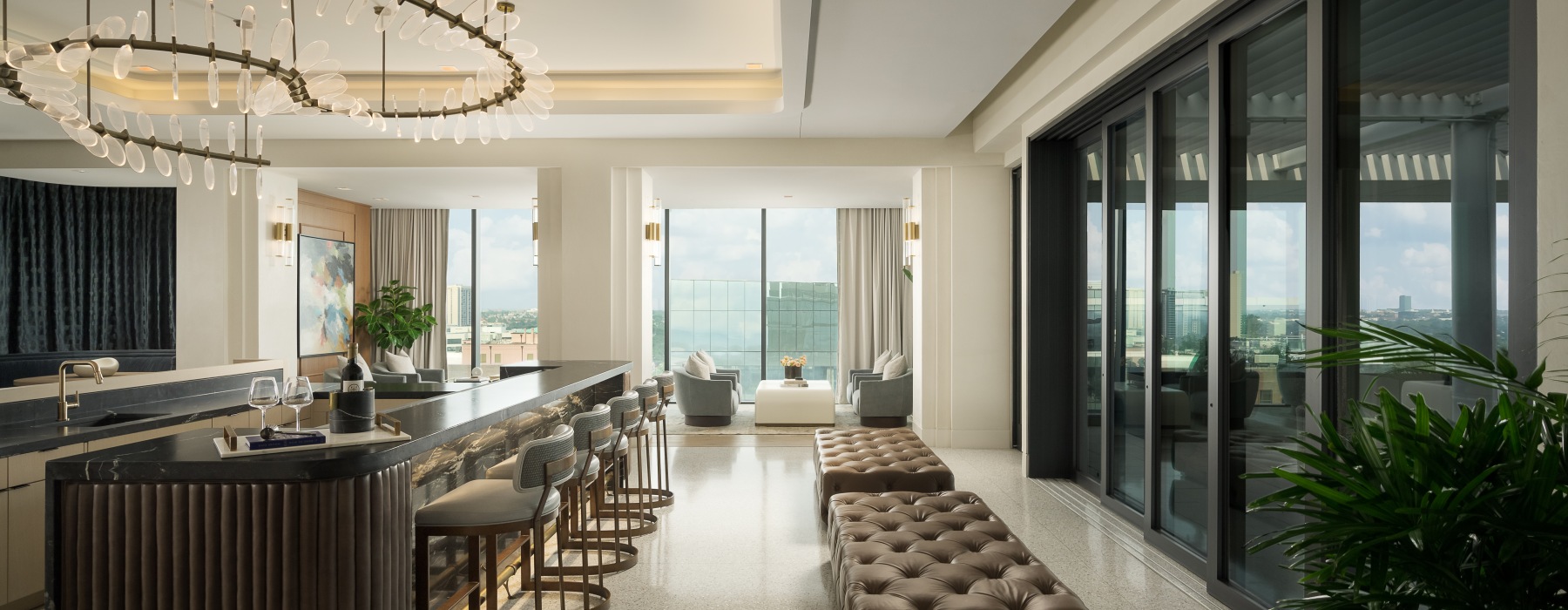 luxury rooftop bar with floor to ceiling windows and lounge areas